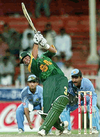 South Africa's Jacques Kallis, smashes one of his six's in one over, before reaching 53 not out, during the India/South Africa cricket match at the Sharjah cricket ground, UAE, on Monday, in the Sharjah cricket 2000 cup