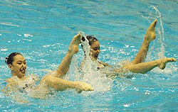 South Korea's Jang Yoon-kyeong (left) and Yoo Na-mi perform in the technical routine of the synchronized swimming duet event of the 6th Asian Swimming Championships, at the Sajik Pool in the Pusan, DSouth Korea, on Wednesday