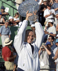 Martina Hingis of Switzerland holds up the winning trophy after beating Lindsay Davenport 6-3, 6-2, in the womens finals of the Ericsson Open in Key Biscayne, Fla., on Saturday