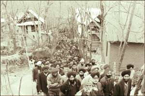 Columns of mourners at Chitti Singhpora village where the bhog ceremony of the slain Sikhs was held on Saturday