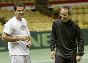 United States Davis Cup team member Pete Sampras (left) shares a laughter with team captain John McEnroe during practice on Tuesday