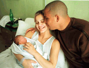 Brazilian soccer star Ronaldo, his wife Milene and newborn Ronald are seen in a Milan's hospital, Italy, on Thursday