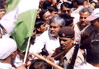Police arresting former Bihar Chief Minister Nitish Kumar during Bihar Bandh in Patna on Friday