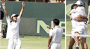 A much relieved Vishal Uppal raises his hands in joy while his partner Leander Paes looks on.