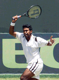 Leander Paes in action against South Korean Hyung-Taik Lee during the Davis Cup Asia Oceania Group 1 second round tie in New Delhi on Sunday