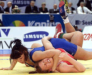 Tatiana Komarnytska of the Ukraine (left) competes with Edyta Witowska of Poland in the women's 75kg class free style final during the European Wrestling Championships in Budapest on Sunday. Komarnytska won the gold medal.