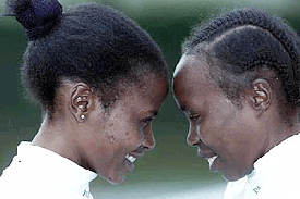 Winner of last years London Marathon Joyce Chepchumba, left, looks directly into the eyes of freind and running opponent Tegla Loroupe during a photocall in the centre of London on Wednesday