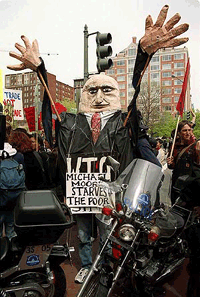 A demonstrator dressed as Michael Moore, the director-general of the World Trade Organization, protests near the World Bank building in Washington, on Thursday, as the World Bank and International Monetary Fund prepare for their spring meetings this weekend.