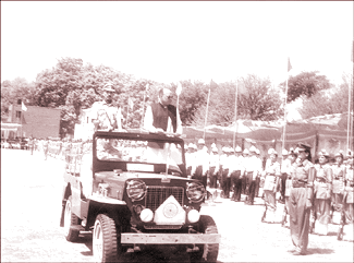 Chief Minister Prem Kumar Dhumal inspects the parade on the occasion of the state-level Himachal Day function at Saloh in Una district on Saturday