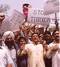 Demonstrators carry an effigy of Pakistans military ruler General Parvez Musharraf to the Pakistan High Commission to protest against its involvement in anti-India terrorist activities in New Delhi on Saturday