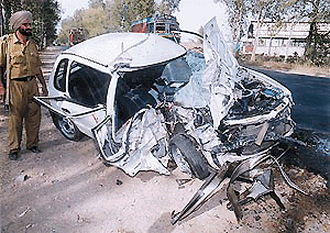 The remains of the car which collided head-on with a truck, claiming two lives, on the Chandigarh-Ambala National Highway in Dappar village, near Lalru, on Monday