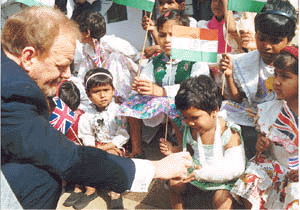 British Foreign Secretary Robin Cook with some of the inmates of Palana, a childrens home run by the Delhi Council of Child Welfare on Tuesday. Mr Cook presented a Toyota Qualis jeep to the home.