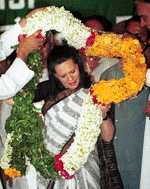 Congress president Sonia Gandhi being garlanded at Rashtriya Kisan Sammelan organised by Bharat Krishak Samaj in New Delhi on Tuesday