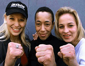 Bulgarian female boxer Daisy Lang, British Michele Aboro and German Regina Halmich, from left to right, posing for the "Boxing Ladies Night" Wednesday, in Cologne