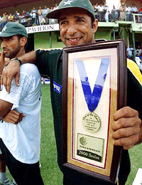 Pakistan all rounder Wasim Akram pose for photographers shortly after winning the Man of the match trophy, during the first finals of the Cable & Wireless triangular series at Kensington Oval in Bridgetown, Barbados Wednesday