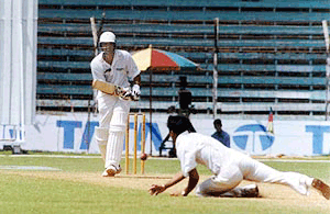 Hyderabad skipper Azaruddin drives straight past the bowler in the second day of the Ranji finals at the Wankhade statidum in Mumbai on Thursday