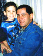   ANDREWS AIR FORCE BASE, USA : Juan Miguel Gonzalez holds his son Elian after a reunion at Andrews Air Force Base, Md., Saturday. Seized by armed agents before dawn, Elian Gonzalez was reunited with his father after a frantic and forceful end to a five-month standoff between the government and the Cuban boy's Miami relatives.
