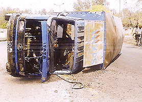 A speeding Canter overturned near the Hallo Majra roundabout in Chandigarh on Wednesday. Two of its occupants were injured.  Tribune photo by Parvesh Chauhan