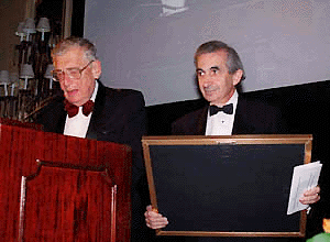 Louis J. Boccardi, right, president and CEO of The Associated Press, accepts the Overseas Press Club President's Award for lifetime achievement from Roy Rowan, president of the Overseas Press Club, in New York, on Thursday.