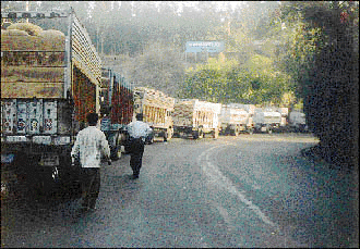 Trucks park on the National Highway in Parwanoo Town
