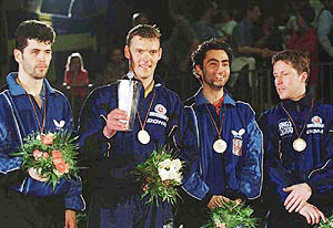 European champion, Swedish table tennis player Peter Karlsson (2nd left) winner of the silver medal Croatian Zoran Primorac, left, and winner of the bronze medals Czech Petr Korbel (2nd right) and Swedish Jan-Ove Waldner (right) during the winner's ceremony at the European Table Tennis Championships in Bremen, Germany, on Monday
