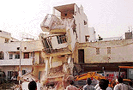 One of the illegal multi-storey buildings demolished at Karbala area of south Delhi by NDMC in New Delhi on Tuesday