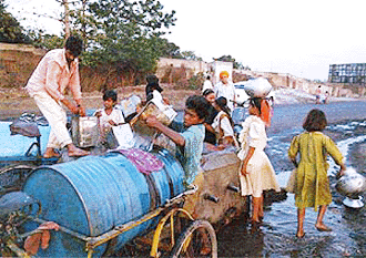 Peoples of Jharia colliery area taking drinking water from Dhanbad-Jharia road