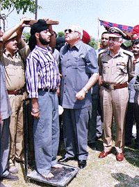 Jammu and Kashmir Chief Minister, Dr Farooq Abdullah himself supervising selection of policemen at Chatti Singhpora, the scene of March 20 massacre of 35 Sikhs in Anantnag district of south Kashmir on Thursday. Director General of State Police, Gurbachan Jagat (right) is also seen in the picture
