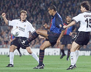 Brazilian midfielder Rivaldo tries to control the ball 