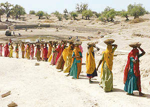 Hard times ahead: Women at work to dig a pond in Rajasthan