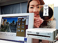 Matsushita Electric unveils a DVD-Ram disc drive LF-D200JD and its 9.4-giga byte DVD-Ram disc which can store data on both sides of the disc at a press preview in Tokyo on Monday. � AFP