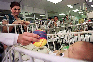   SAN SALVADOR  : Miss World, Yukta Mookhey, from India, hands out gifts in Benjamin Bloom Hospital, San Salvador, El Salvador on Monday. Mookhey visited children with kidney problems and took part in the donation of 12 dialysis machines which will help up to 116 children.