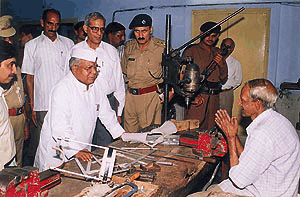 The Haryana Governor, Mr Mahavir Prasad, interacts with an artificial-limb maker during his visit to Saket Hospital in Chandimandir on Tuesday 