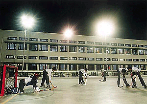 Roller hockey players of KB DAV Centenary School, Sector 7, Chandigarh, practise under floodlights