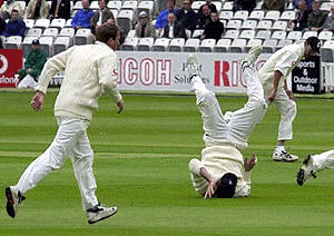 An England fielder fails to stop the ball during the first Test between England and Zimbabwe on Thursday at Lord's on the first day of the five-day match