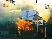 A building burns in Suva, Fiji, on Friday in this image made from television