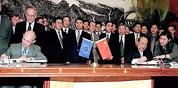   BEIJING : European Union Trade Commissioner Pascal Lamy, left, and Chinese Foreign Trade Minister Shi Guangsheng, right, sign an agreement on China's entry into the World Trade Organization (WTO) on Friday in Beijing. The signing of the agreement means China has cleared the largest remaining hurdle to joining world trade's rule making body after a 14 year struggle. AP/PTI.