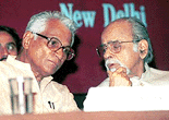 Former Prime Minister I. K. Gujral having a word with Defence Minister George Fernandes at a South Asian Conference on Mehbub-ul-Haq Human Development in New Delhi on Saturday