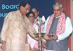 Water Resource Minister Dr C.P. Thakur lends his hand to the Prime Minister Atal Behari Vajpayee to light the lamp marking the inauguration of a national seminar on rain water-harvesting in New Delhi on Monday