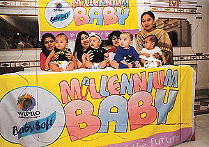 Four winners of Wipro Baby Soft Millennium Awards smiling in their mothers' arms in Chandigarh on Tuesday.