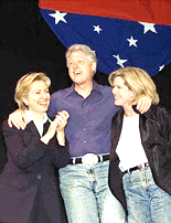 President Clinton with first lady Hillary Rodham Clinton and Tipper Gore, right, wife of Vice President Al Gore, enjoy the festivities as they appear at a Democratic Party fundraiser at Washington's MCI Center, on Wednesday. The Democrats' jeans-and-barbecue evening is a salute to Clinton, with entertainment including Stevie Wonder, Lenny Kravitz and Robin Williams. The fundraiser is expected to bring in more than $25 million