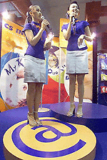 Two sales models introduce Thailand�s latest Internet service provider (ISP), CS Internet, during the opening day of e-Expo 2000, a three-day exhibition on Thailand�s Internet technology. � AFP