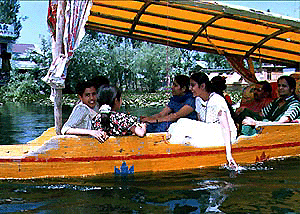 A group of tourists enjoy a shikara ride in the Dal Lake in Srinagar on Thursday.
