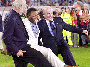 From left, British actor Sean Connery, Brazilian soccer legend Pele' and FIFA president Sepp Blatter joke prior to the start of the "Match of the Heart 2000" exhibition soccer match