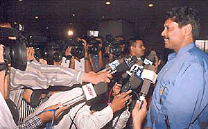 Cricket coach and former captain Kapil Dev surrounded by media persons in New Delhi on Sunday prior to his departure for the Asia Cup series at Dacca