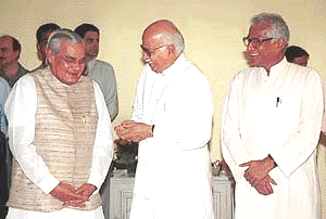 Prime Minister A. B. Vajpayee sharing a lighter moments with Union Home Minister L. K. Advani and Union Defence Minister George Fernandes at IGI Airport in New Delhi on Sunday before President's departure for China.