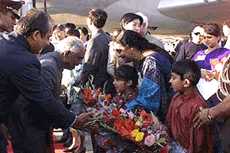 The President being received at Beijing international airport.