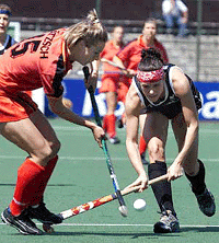 Germany's Heike Latzsch, left, and New Zealand's Robyn Matthews in action during Championship Trophy match in Amsterdam on Wednesday