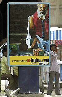 A billboard in New Delhi advertises an Internet site as VSNL hinted at a huge price cut to compete with market-savvy private firms. � AFP