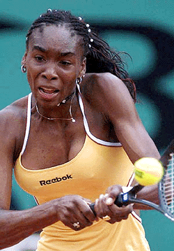 Fourth-seeded Venus Williams of the United States reacts after a winning shot to Jana Kandarr of Germany during their first round match at the French Open tennis tournament at Roland Garros stadium in Paris on Wednesday